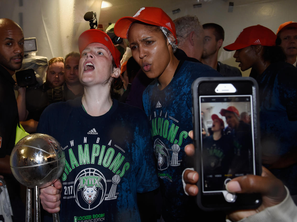 The Minnesota Lynx's Lindsay Whalen and Maya Moore celebrate winning the 2017 WNBA championship. (Hannah Foslien/Getty Images)