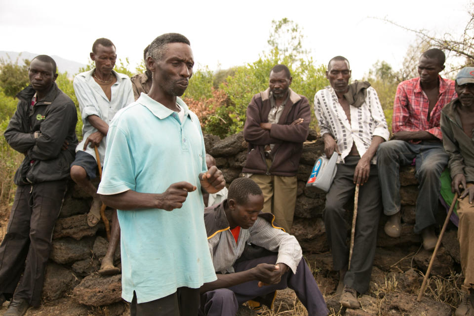 Joseph Kariuki speaks to locals about getting treated for the flesh-eating disease cutaneous leishmaniasis. (Photo: Zoe Flood)