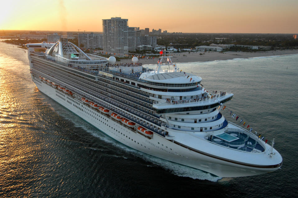 FILE - The new Caribbean Princess departs on its maiden voyage from Port Everglades in Fort Lauderdale, Fla., in this April 3, 2004 file photo. Federal health officials are investigating after an outbreak of illness has caused Caribbean Princess cruise ship to ends its trip early and returned to port in Houston late Thursday, Jan. 30, 2014 more than a day ahead of schedule after more than 170 passengers and crew members aboard became sick. (AP Photo/Princess Cruises, Andy Newman, File)