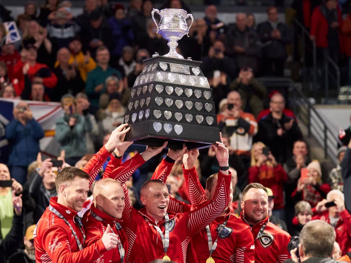 Brad Gushue's Team Canada celebrates their 7-5 victory over Matt Dunstone's Team Manitoba in the Brier final on Sunday at Budweiser Gardens in London, Ont. (Geoff Robins/The Canadian Press - image credit)