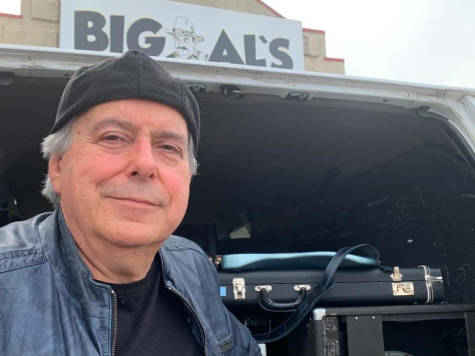 Doug Charters, a professional audio technician and musician, pictured here outside Big Al’s Bar & Grill in southeast Calgary on Tuesday, was out of most work for nearly two years after the COVID pandemic hit. 'It's kind of like almost drowning. And then you get back to the beach, you know, and you realize, oh, well, that was close.' (Joel Dryden/CBC - image credit)