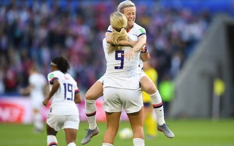 Lindsey Horan #9 celebrates scoring with teammate Megan Rapinoe #15 during a 2019 FIFA Women's World Cup France group F match between the United States and Sweden  - Credit: Getty images