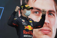 Red Bull driver Max Verstappen of the Netherlands celebrates on podium after winning the Emilia Romagna Formula One Grand Prix, at the Imola racetrack, Italy, Sunday, April 18, 2021. (AP Photo/Luca Bruno)