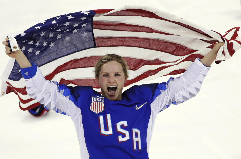 FILE - In this Feb. 22, 2018, file photo, Jocelyne Lamoureux-Davidson, of the United States, celebrates after winning against Canada in the women's gold medal hockey game at the 2018 Winter Olympics in Gangneung, South Korea. Olympic women's hockey gold medalists Lamoureux-Davidson and her sister Monique Lamoureux-Morando have unveiled their foundation that has a goal of benefiting underserved children and communities, primarily in their home state of North Dakota. The 30-year-old Grand Forks natives and University of North Dakota standouts helped the United States win the gold medal in South Korea in 2018. (AP Photo/Matt Slocum, File)