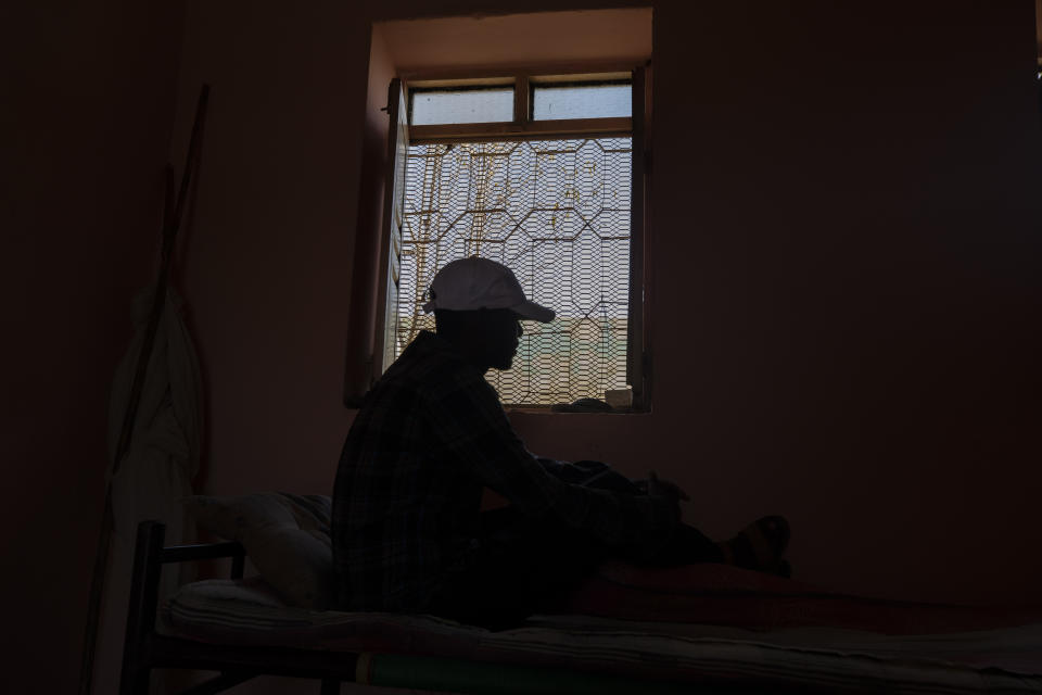 Tigrayan refugee Kidu Gebregirgis, a farmer who fled the conflict in Ethiopia's Tigray, is photographed in eastern Sudan, near the border with Ethiopia, on March 15, 2021. Gebregirgis said he was questioned almost daily about his ethnicity, his shirt yanked aside to check for marks from the strap of a gun. He said the Amhara harvested some 5,000 kilograms (5.5 tons) of sorghum from his fields and hauled it away. The task took two weeks to complete. He never tried to stop them. (AP Photo/Nariman El-Mofty)