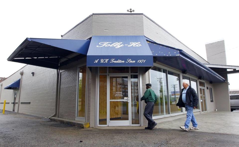 William Million, left, and John Wright, right, entered the new location of the Tolly-Ho, 606 S Broadway in Lexington, Ky., Thursday, May 19, 2011. After being on South Limestone for 25 years, the popular restaurant reopened at 6 a.m. this morning at the new location. Million and Wright were regulars at the old location. Charles Bertram | Staff...