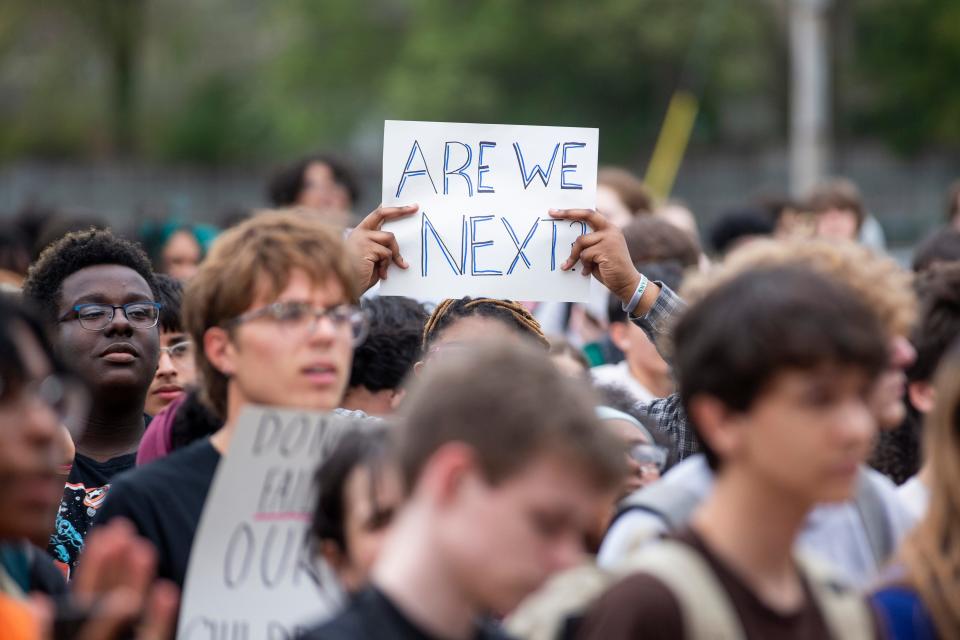 A student holds up a sign asking “are we next?” during a “Walkout to End Gun Violence” event outside the school hosted by Students Demand Action in Memphis, Tenn., on Wednesday, April 5, 2023. The walkout comes a week after the school shooting at The Covenant School in Nashville that left six dead, including three students. 