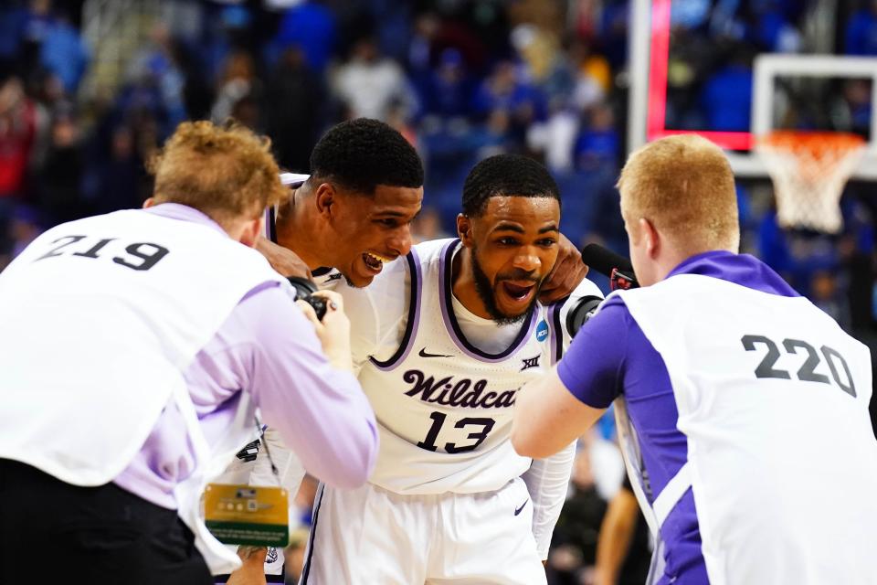 Kansas State guard Desi Sills (13) and teammates celebrate their victory over Kentucky last Sunday in the second round of the NCAA Tournament at Greensboro, N.C.