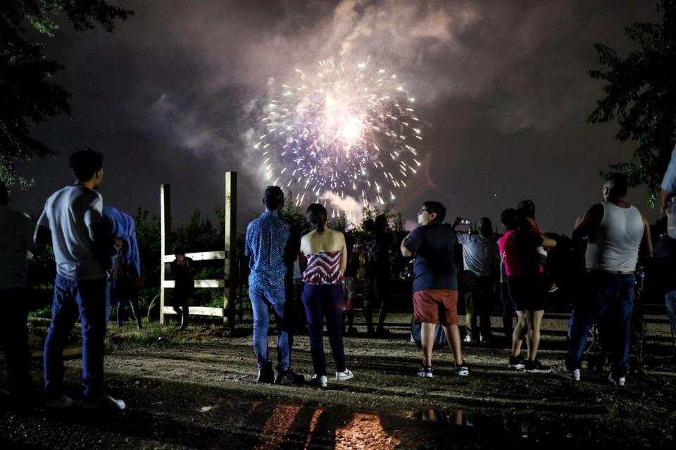 Those leaving Dorothea Dix Park stop and watch an abbreviated fireworks show from Hunt Drive Thursday, July 4, 2024.