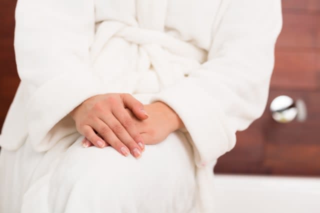 Woman in white dressing gown