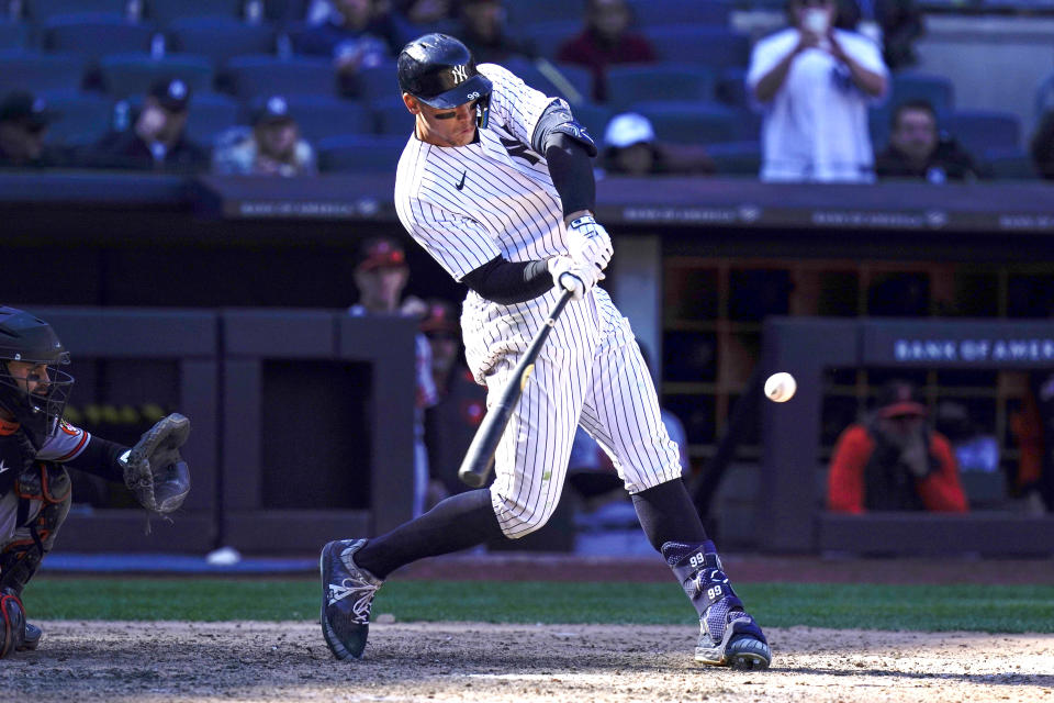 New York Yankees' Aaron Judge hits a three-run homer during the eighth inning of a baseball game against the Baltimore Orioles at Yankee Stadium, Thursday, April 28, 2022, in New York. (AP Photo/Seth Wenig)