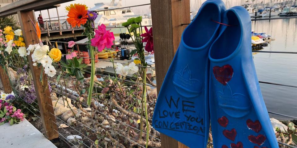 A memorial outside Truth Aquatics for the victims of the Conception boat fire, Monday, Sept. 2, 2019. A fire raged through a boat carrying recreational scuba divers anchored near an island off the Southern California coast early Monday, leaving multiple people dead and hope diminishing that any of the more than two dozen people still missing would be found alive. (AP Photo/Stefanie Dazio)