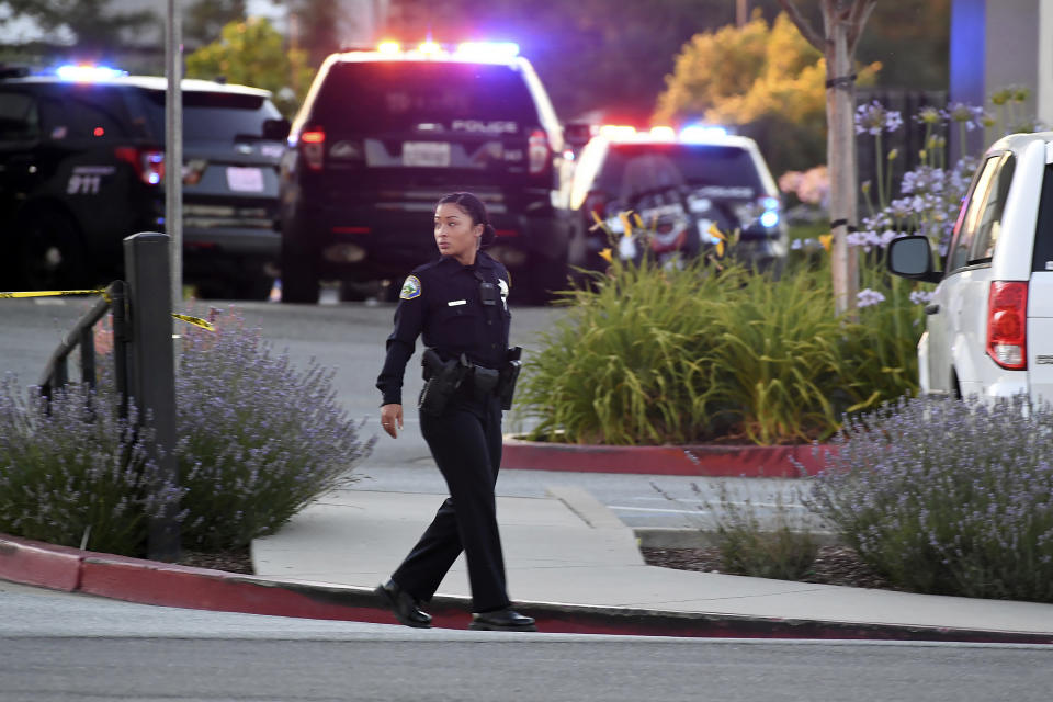 Police investigate at the scene of a shooting at the Morgan Hill Ford Store in Morgan Hill, Calif., Tuesday, June 25, 2019. Police say the shooting has killed at least two people in what may be a workplace confrontation. (AP Photo/Nic Coury)
