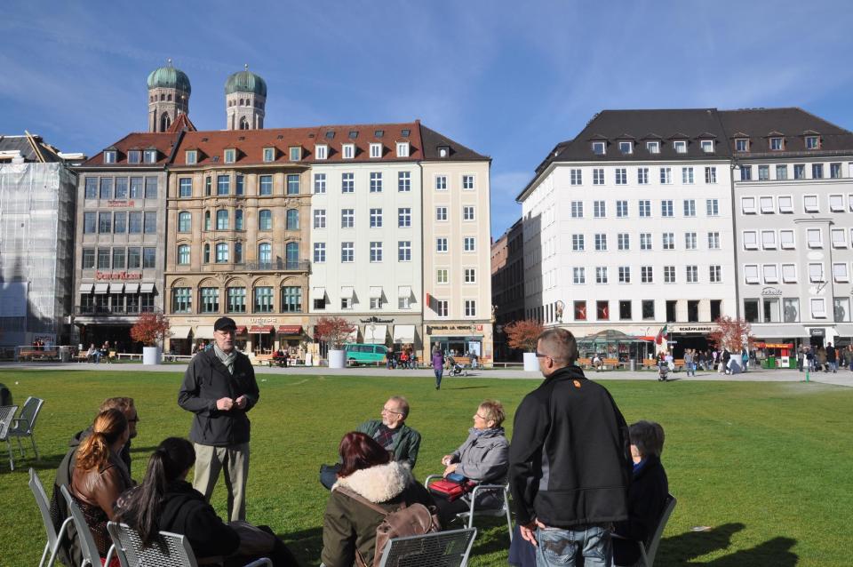 In this photo taken on Oct. 19, 2013, Eric Loerke of Munich Walk Tours talks with tourists about the city's role in the rise of Adolf Hitler before taking them on a tour of sites associated with the Nazis in Munich, Germany. (Photo by Terrence Petty)