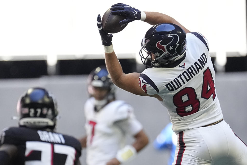 Houston Texans tight end Teagan Quitoriano (84) catches the ball in the first half of an NFL football game against the Atlanta Falcons in Atlanta, Sunday, Oct. 8, 2023. (AP Photo/John Bazemore)