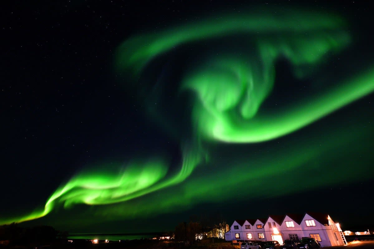 The northern lights, also known as the aurora borealis, illuminate the sky in southeastern Iceland on 7 October, 2018 (Getty Images)