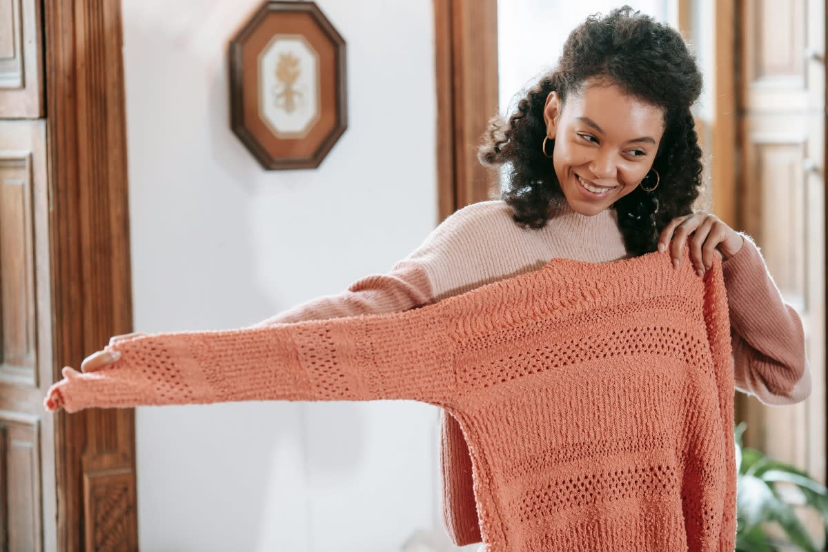 black woman showing knitted sweater