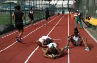 Youths attend a training session in the Mangueira Olympic Village in Rio de Janeiro, Brazil, August 16, 2016. REUTERS/Ricardo Moraes