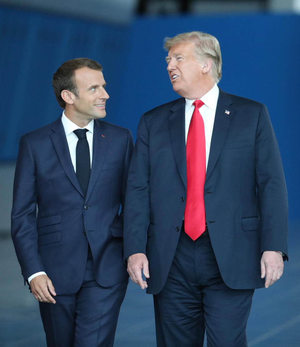 <p>France’s President Emmanuel Macron arrives with President Trump for the NATO summit, at the organization’s headquarters in Brussels on July 11, 2018. (Photo: Tatyana Zenkovich/pool/AFP/Getty Images) </p>