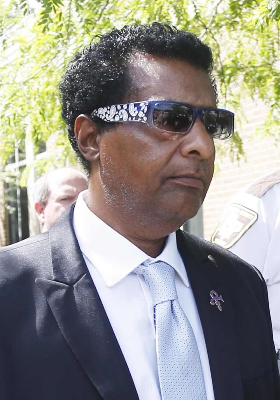 FILE - In this June 27, 2016 file photo, Alfred Jackson, a half-brother of Prince, leaves the Carver County courthouse in Chaska, Minn. after a hearing over how to verify who qualified as Prince's heirs. Jackson, 66, one of the six heirs to the Prince estate, has died, leaving five Prince siblings to share in the late rock superstar's fortune. (AP Photo/Jim Mone,File)
