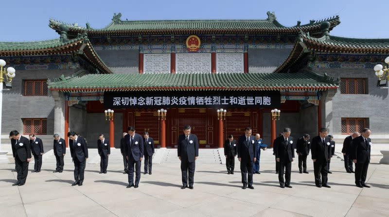 Chinese leaders stand in silence during the national mourning in Beijing