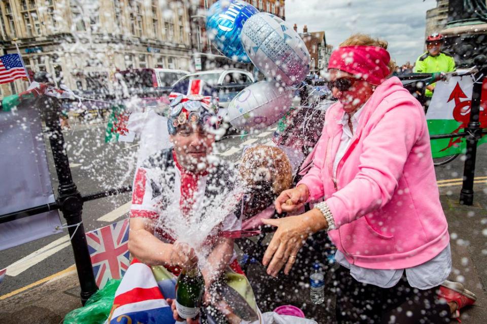 Two fans celebrate Archie's christening outside Windsor Castle.