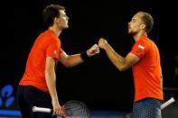 Britain's Jamie Murray (L) and Brazil's Bruno Soares react during their doubles final match at the Australian Open tennis tournament at Melbourne Park, Australia, January 31, 2016. REUTERS/Issei Kato