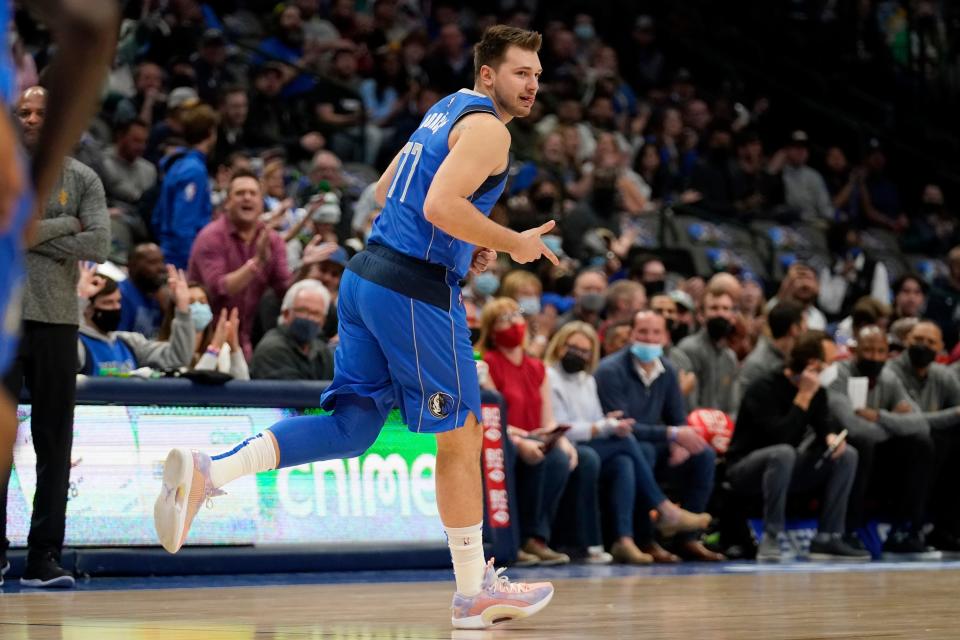 Dallas Mavericks guard Luka Doncic celebrates sinking a 3-point basket in the first half of a 114-96 loss to Cavaliers on Monday night Dallas. [Tony Gutierrez/Associated Press]