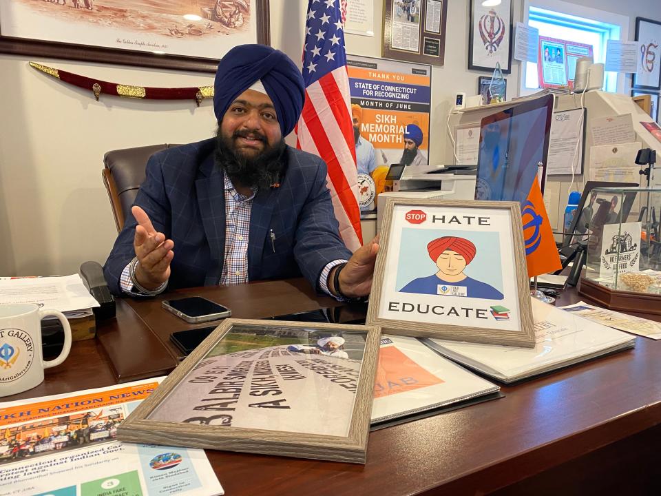 Swaranjit Singh Bhatia at his desk at the Sikh Art Gallery in Norwich. Sept. 10, 2021.