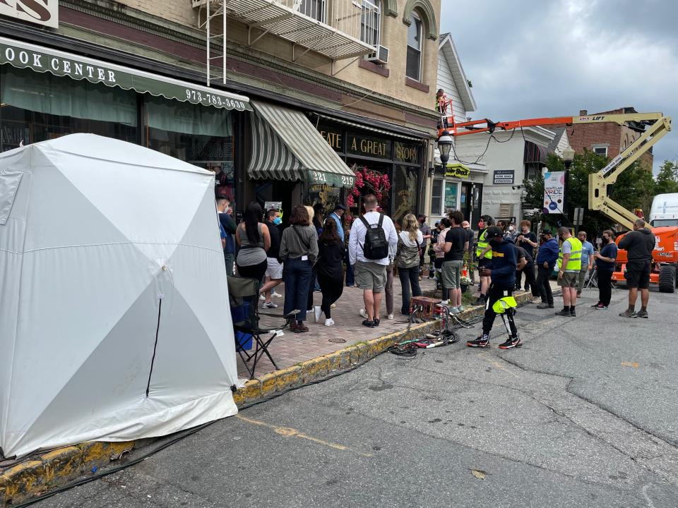 Crew from the set of "Girl Meets Boy," an HBO movie being filmed at the White Rabbit Black Heart gift shop on Glenridge Ave. in Montclair. June 22, 2022.