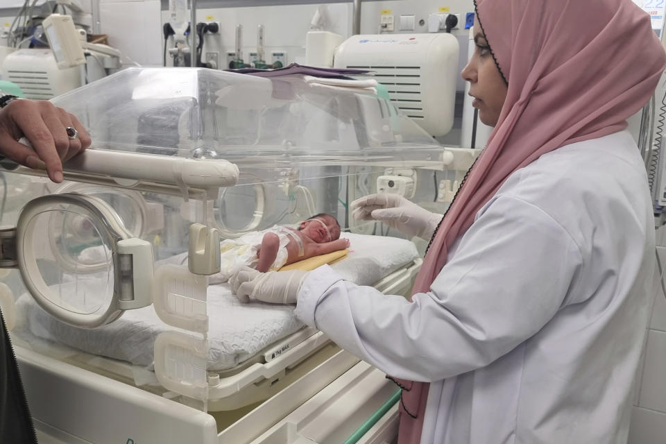 A Palestinian baby girl, Sabreen Jouda, who was delivered prematurely after her mother was killed in an Israeli strike along with her husband and daughter, lies in an incubator in the Emirati hospital in Rafah, southern Gaza Strip. Sunday, April 21, 2024. (AP Photo/Mohammad Jahjouh)