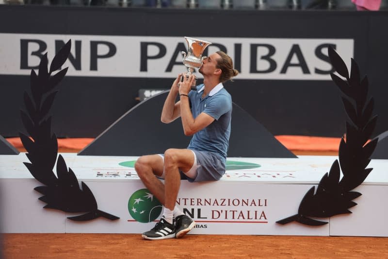 German tennis player Alexander Zverev celebrates with the trophy after defeting Chile's Nicolas Jarry to win the final tennis match of the Italian Open tennis tournament in Rome. Marco Iacobucci/Ipa Sport/IPA via ZUMA Press/dpa