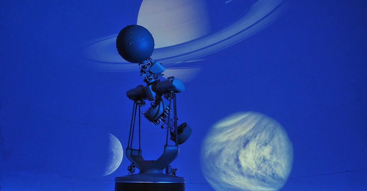 The Angelo State University Planetarium projector displays various planets on the dome.