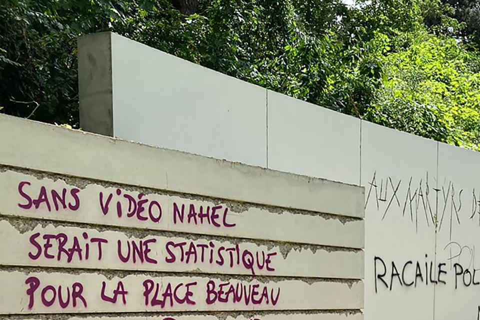 A graffiti reads "Without video, Nahel would be a statistic for the Interior Ministry" on a monument commemorating Holocaust victims and members of the French resistanceSunday, July 2, 2023 in Paris suburb Nanterre. The monument commemorating Holocaust victims and members of the French resistance during World War II was still defaced with graffiti Sunday, after it has been vandalized Thursday on the margins of a silent march to pay tribute to Nahel. Vandals painted anti-police slogans including "Police scum from Saint-Soline to Nanterre," "Don't forget or forgive," and "Police, rapists, assassins" (AP Photo/Cara Anna )