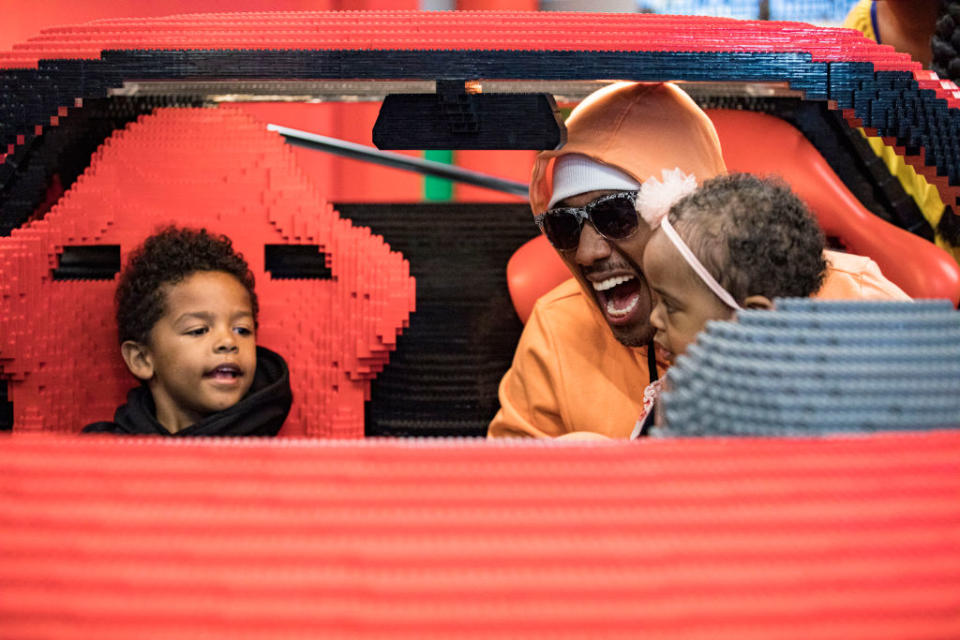 CARLSBAD, CALIFORNIA - MAY 11: (L-R) Golden Cannon, Nick Cannon, and Powerful Queen Cannon pose inside a life-sized LEGO Ferrari at LEGOLAND California on May 11, 2022 in Carlsbad, California. (Photo by Daniel Knighton/Getty Images)