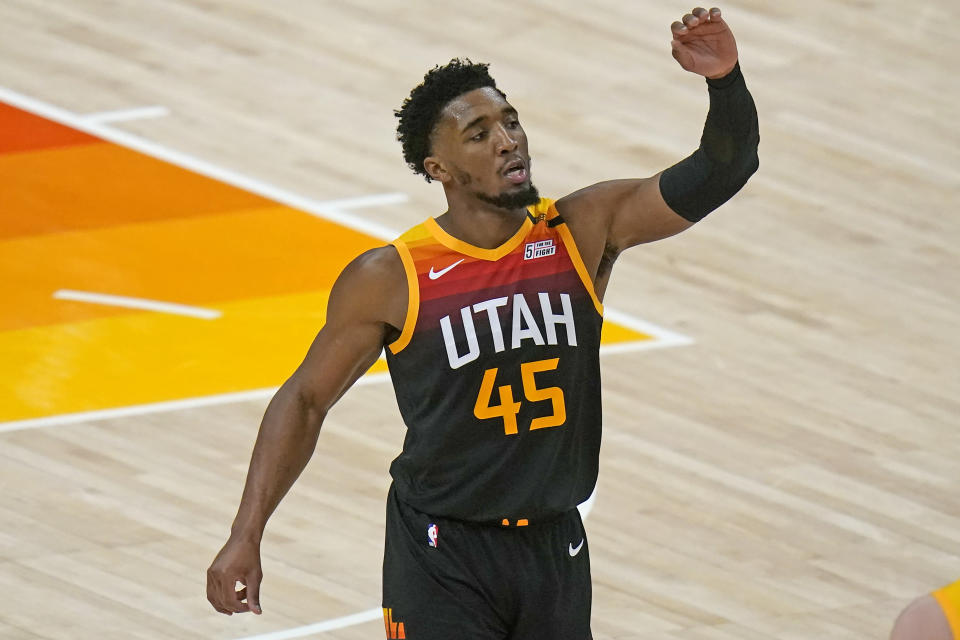 Utah Jazz guard Donovan Mitchell celebrates after dunking against the Los Angeles Lakers during the second half of an NBA basketball game Wednesday, Feb. 24, 2021, in Salt Lake City. (AP Photo/Rick Bowmer)