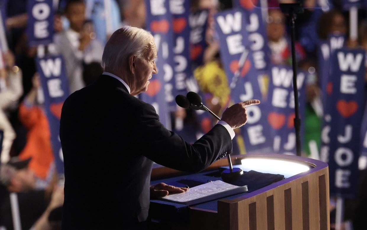 Joe Biden speaks onstage during the first day of the Democratic National Convention at the United Center in Chicago