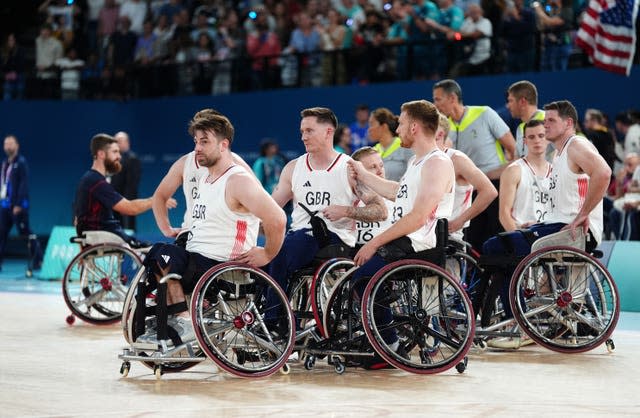 Great Britain players appear dejected after defeat in the wheelchair basketball gold medal match at Paris 2024