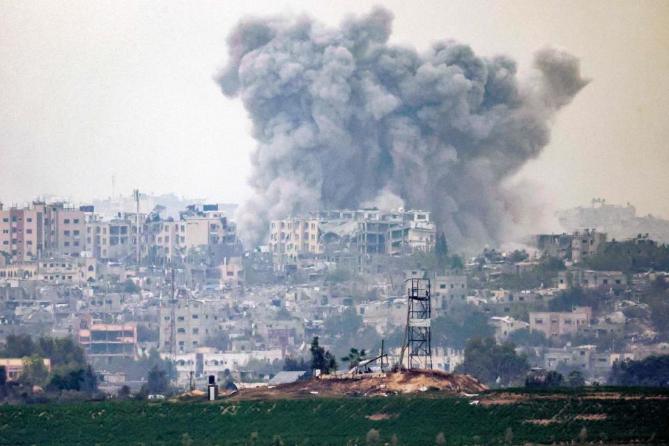 A smoke plume following Israeli bombardment over the northern Gaza Strip earlier on Friday (AFP via Getty Images)