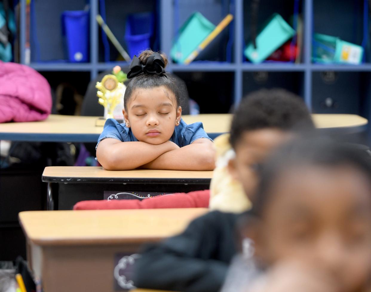 Jada Sumpter, a second-grade student in teacher Jennifer Schott's classroom at Worley Elementary School in Canton, listens to the music playing over the announcement system while participating in Mindful Music Moments. Each morning, the school starts the day with music through a partnership with the Canton Symphony Orchestra and The Well, a Cincinnati-based nonprofit.