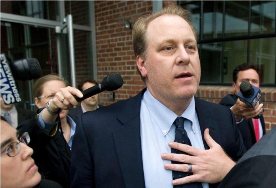 Former Boston Red Sox pitcher and the founder of the failed videogame company, 38 Studios, Curt Schilling is met by reporters as he departs the Rhode Island Economic Development Corporation headquarters in Providence in 2012.