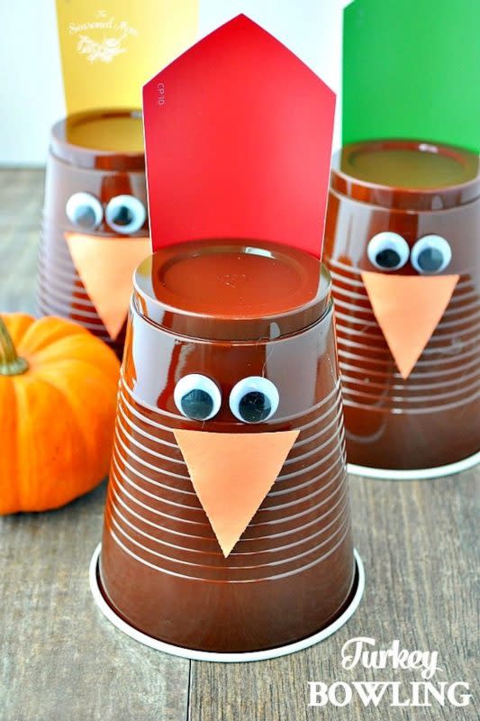<p>The Seasoned Mom</p><p>You won’t strike out with your family if you use turkey-themed cups as bowling pins and mini pumpkins as bowling balls for this game! See <a href="https://www.theseasonedmom.com/thanksgiving-game-turkey-bowling/" rel="nofollow noopener" target="_blank" data-ylk="slk:The Seasoned Mom;elm:context_link;itc:0;sec:content-canvas" class="link "><em>The Seasoned Mom</em></a> for all the steps for this activity.</p>