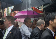 <p>U.S. President Barack Obama greets people as he walks to his motorcade vehicle after meeting American Chef Anthony Bourdain in a shopping area in Hanoi, Vietnam, Tuesday, May 24, 2016. President Barack Obama taped the second part of an interview with CNN personality Anthony Bourdain before leaving the Vietnamese capital for Ho Chi Minh City on Tuesday. (AP Photo/Carolyn Kaster) </p>