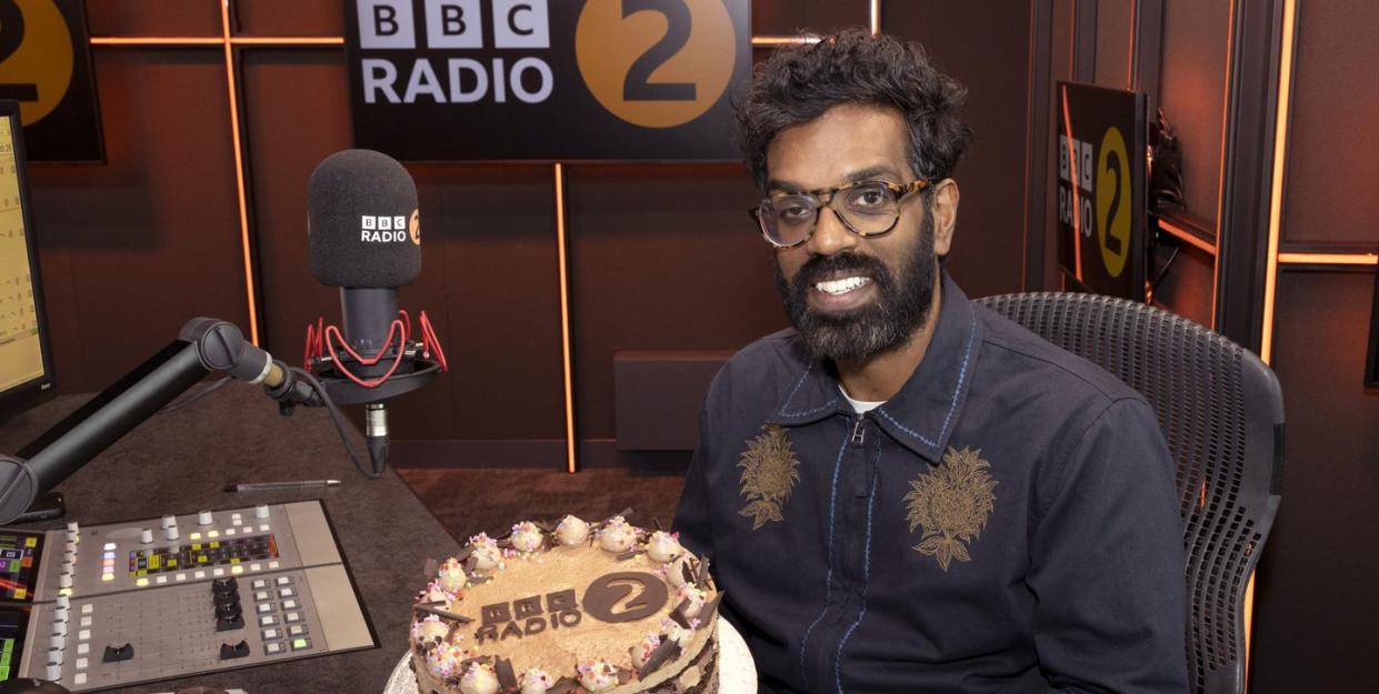 romesh ranganathan with a radio 2 cake