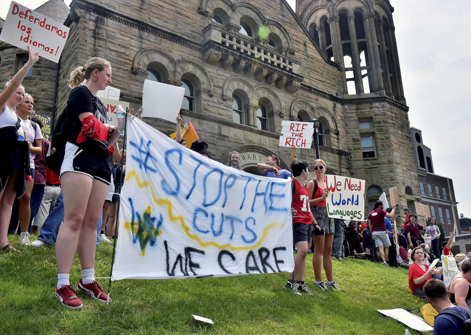 Students gather during a walkout in protest of an administration proposal to cut 9% of majors and amid a $45 million budget shortfall at West Virginia University in Morgantown, W.Va., Monday, Aug. 21, 2023. (Ron Rittenhouse /The Dominion-Post via AP)