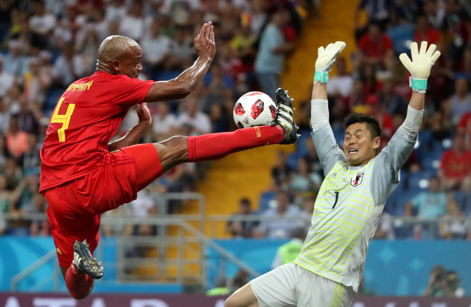 <p>Belgium’s Vincent Kompany in action with Japan’s Eiji Kawashima REUTERS/Marko Djurica </p>