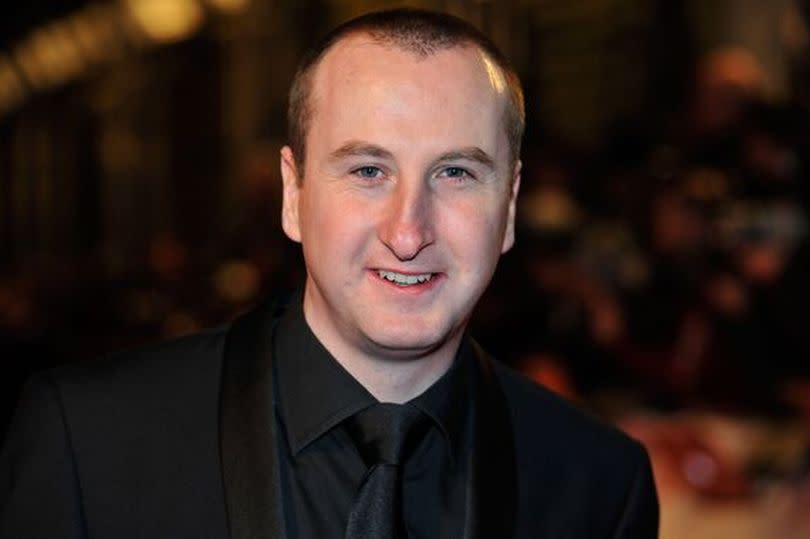 Andy Whyment smiling in a head and shoulders shot