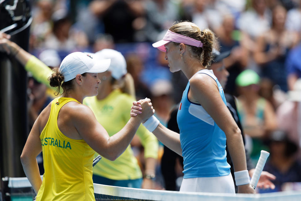 France's Kristina Mladenovic, right, shakes hands with Australia's Ash Barty during their Fed Cup tennis final in Perth, Australia, Sunday, Nov. 10, 2019. (AP Photo/Trevor Collens)