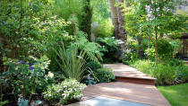 <p> Add to jungle-like gardens with a series of slick, wooden deckboards that weave through densely planted borders. Designed by Cityscapers, this garden is made even more dramatic by the walkways being set on an angle, at varying levels. </p> <p> The rich, red tones of the timber are enhanced by the rusty Corten steel risers and are the perfect complementary color for the lush green planting. </p>