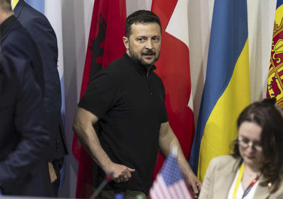 Ukrainian President Volodymyr Zelenskyy arrives for a plenary session, during the Summit on peace in Ukraine, in Obbürgen, Switzerland, Sunday, June 16, 2024. (Urs Flueeler/Keystone via AP)